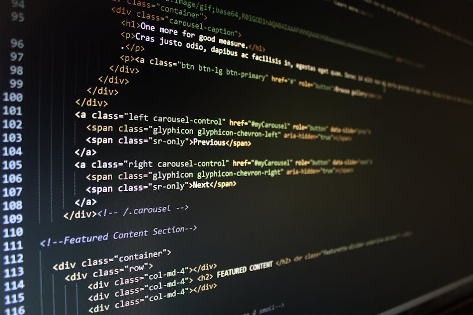 A close-up photograph of a computer screen displaying HTML code with brightly colored syntax highlighting in shades of yellow, green, and white on a dark background. The code shows navigation elements